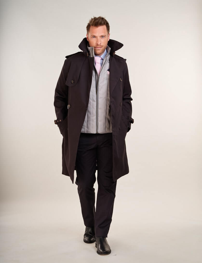 black trench coat  with black chinos and grey gilet 