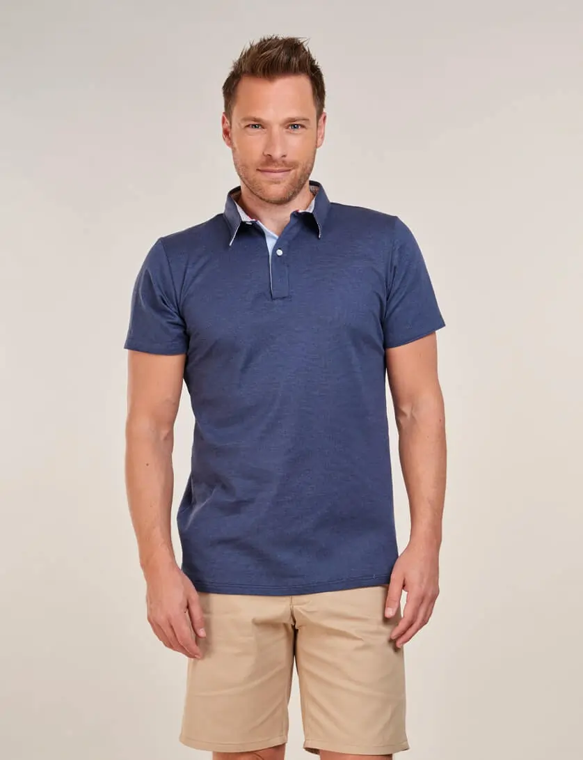 navy polo shirt with beige shorts