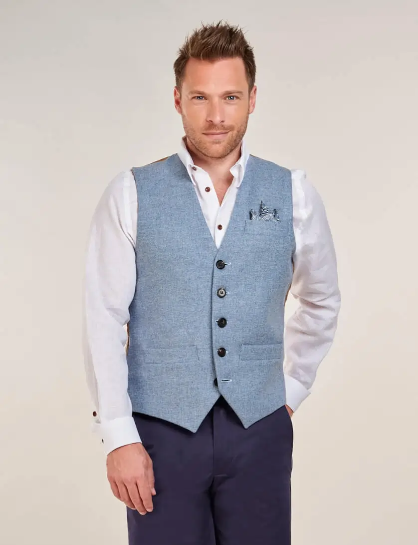 blue tweed waistcoat with white linen shirt and navy shorts