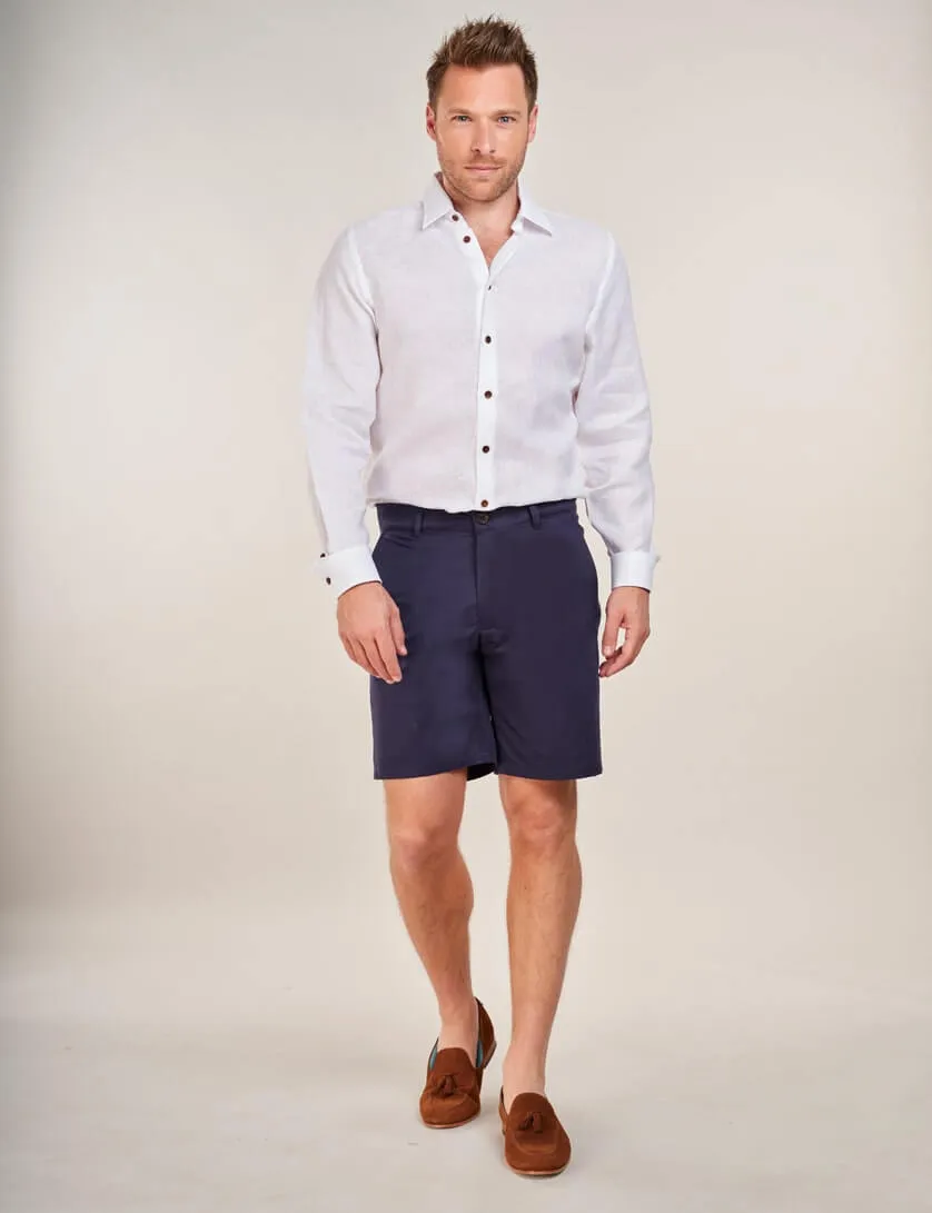 white linen shirt with navy shorts