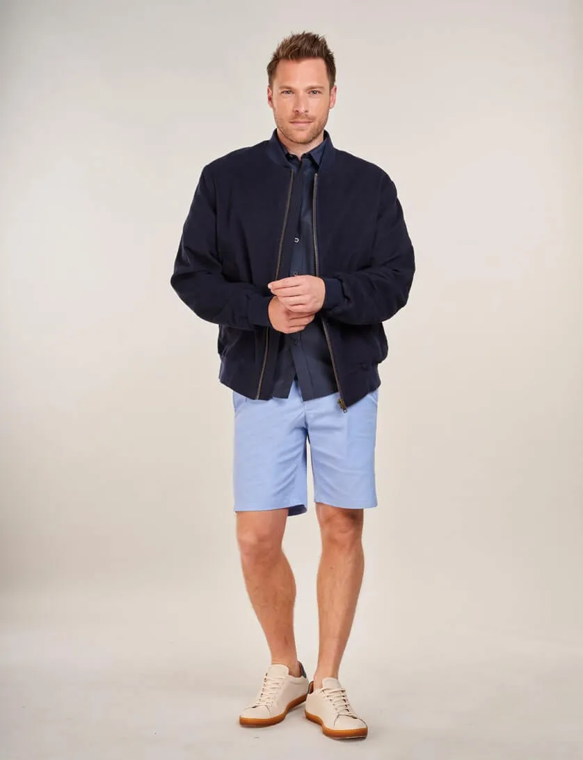 light blue shorts with navy shirt and moleskin bomber